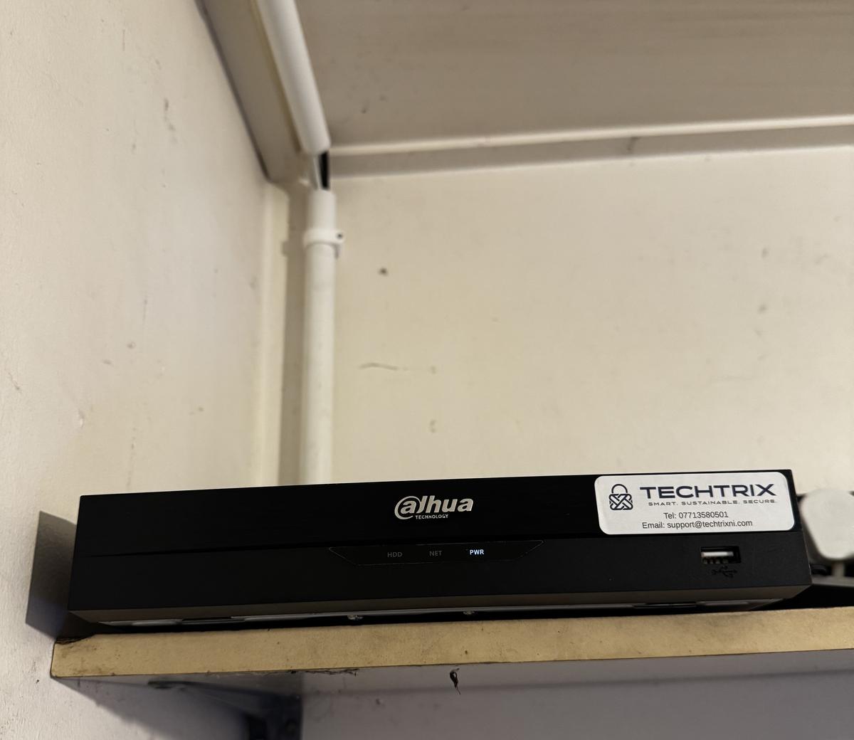 CCTV recorder on a shelf with a Techtrix label