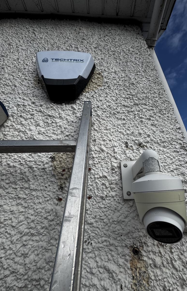 Techtrix bell box and camera on the gable of a shop