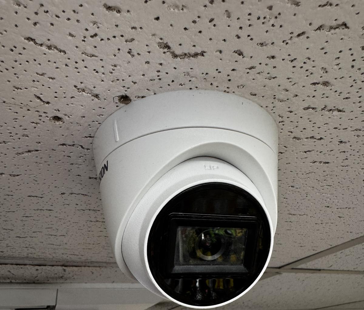 Camera on a suspended ceiling inside a shop