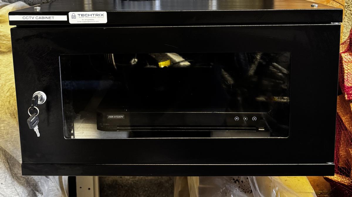 Locked CCTV cabinet holding the recorder in a shop