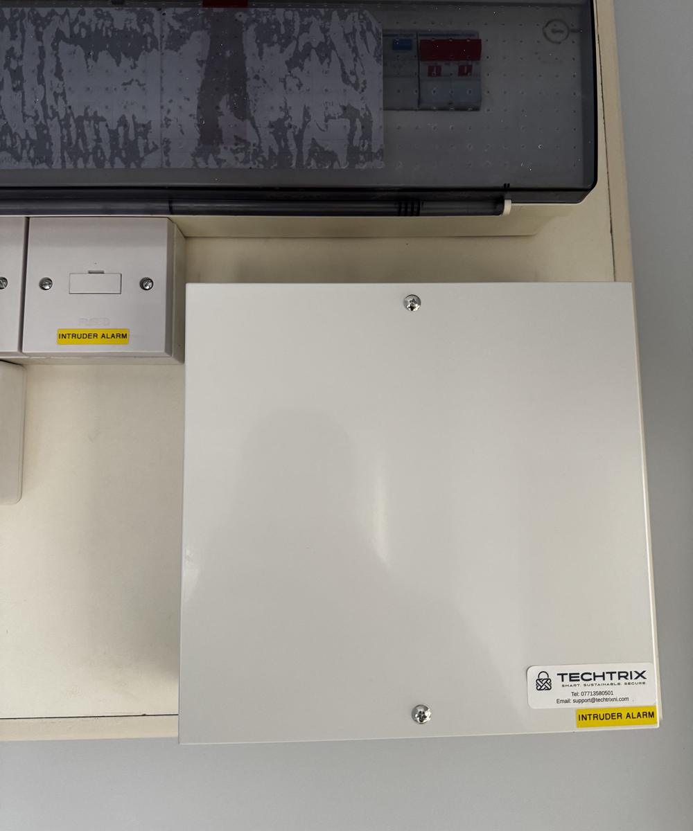 Finished alarm control panel beside the consumer unit